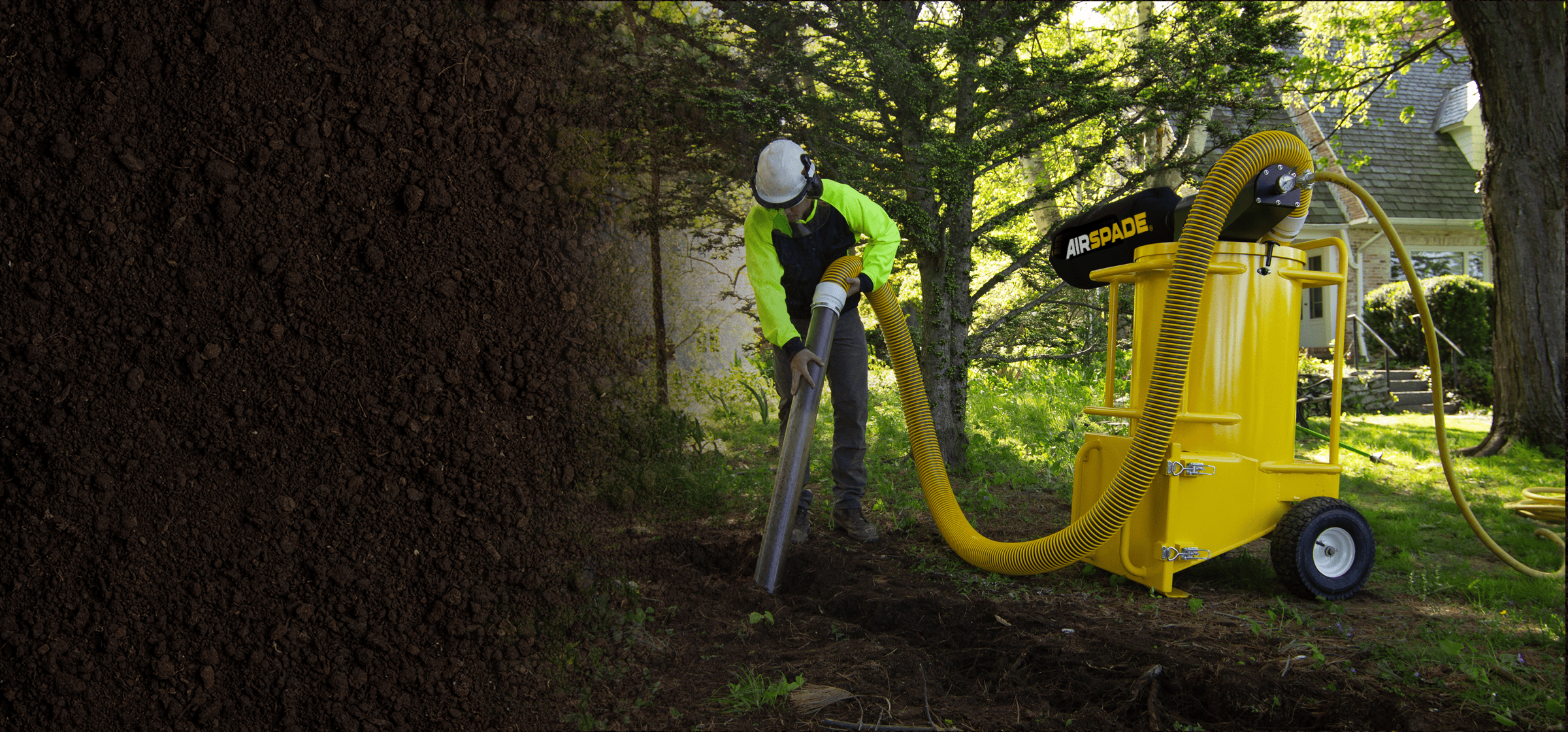 Person using an AirSpade Vac