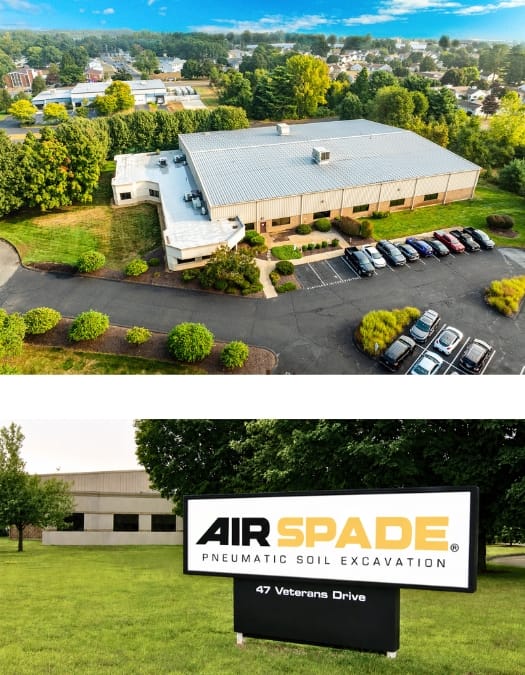 Aerial view of a building with a parking lot and an AirSpade sign in the foreground.